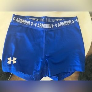 Blue Under Armour practice shorts for girls.